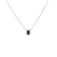 Collana in oro bianco 18 kt con zaffiro blu scuro dal taglio ovale e diamanti